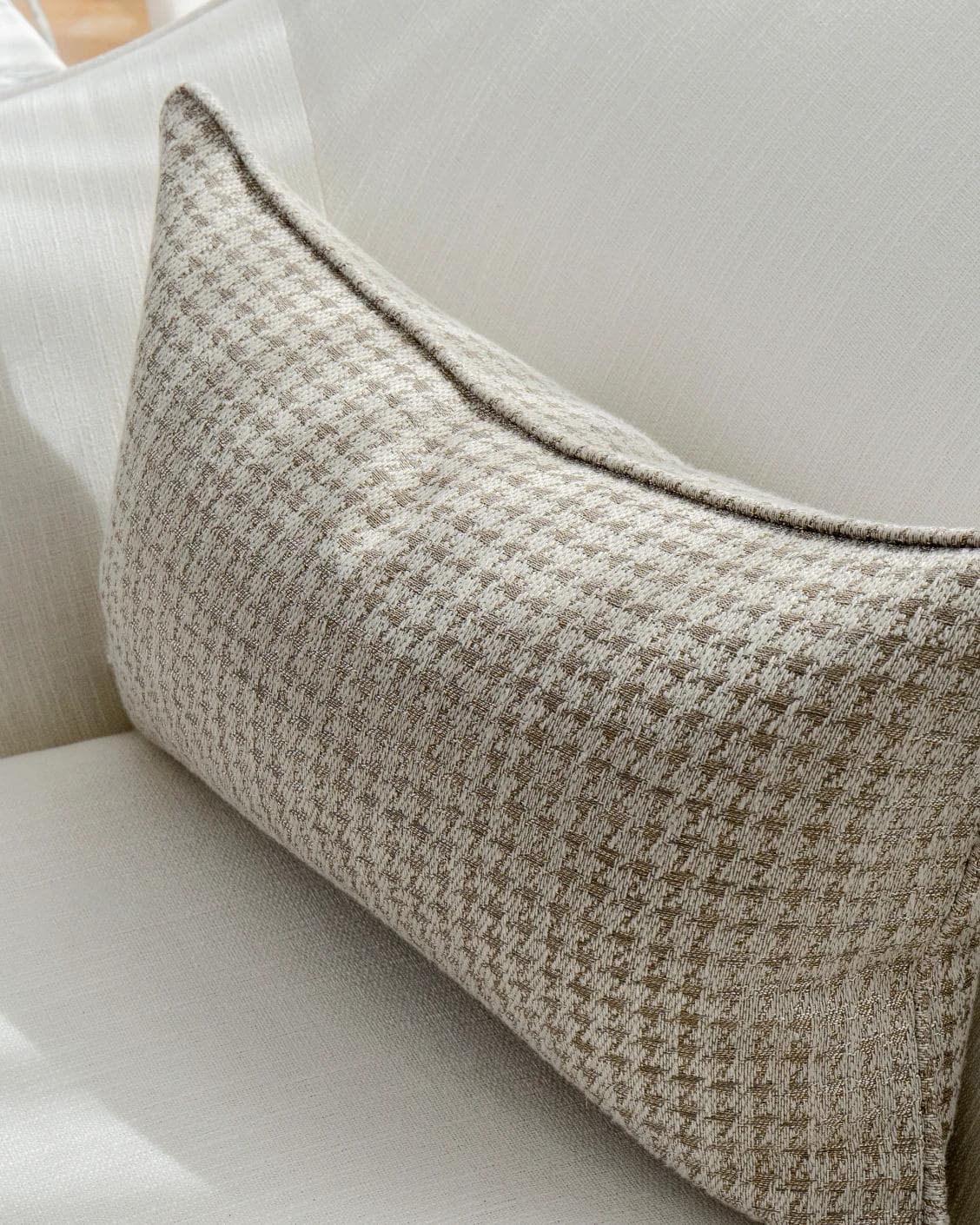 Leo Laurent II cushion in brown and silver, shown in a lifestyle right view as image 5