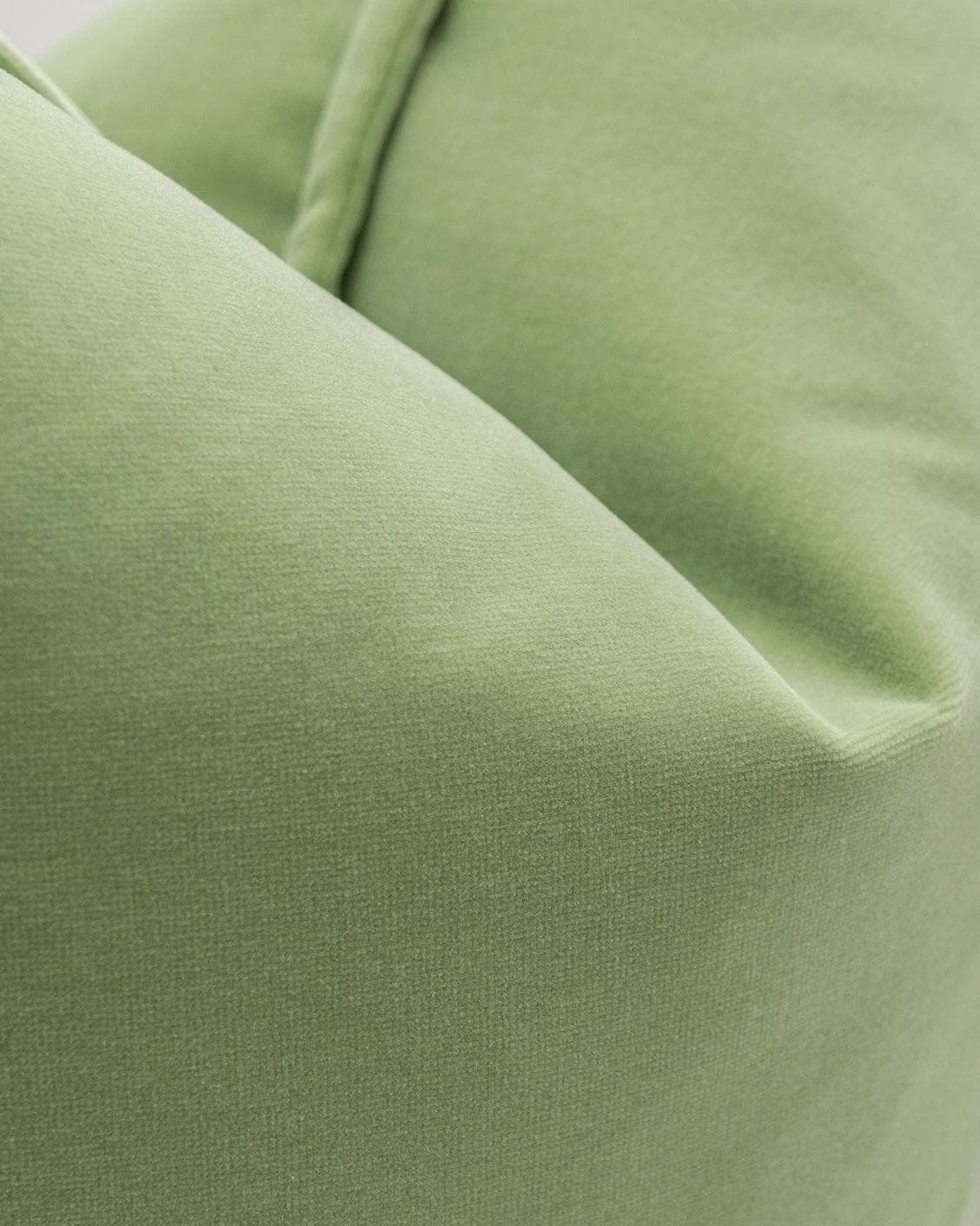 Alessandra Pistachio cushion in green, shown in a product close-up as image 6