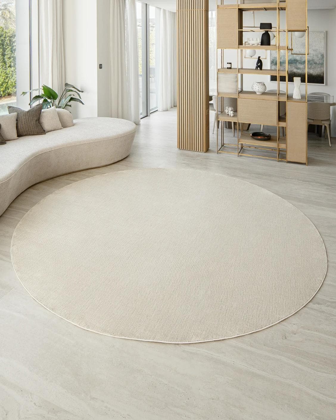 Rik Sandy Round carpet in beige, shown in a lifestyle front view