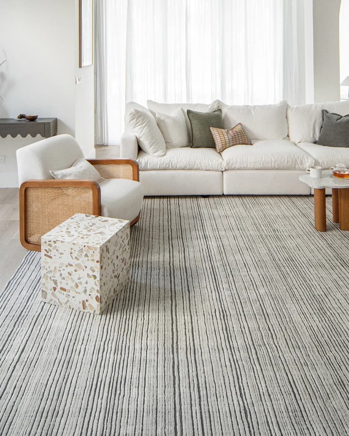 Theodore Ashton carpets in grey and ivory, shown in a lifestyle front view as image 3