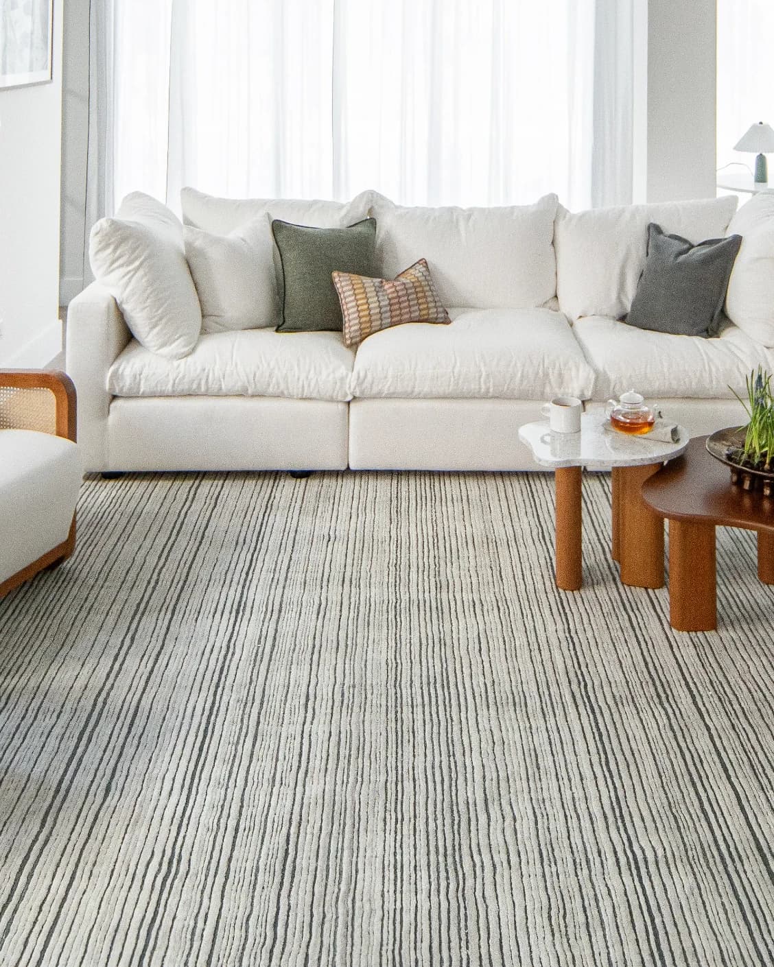 Theodore Ashton carpet in grey and ivory, shown in a lifestyle front view as image 6