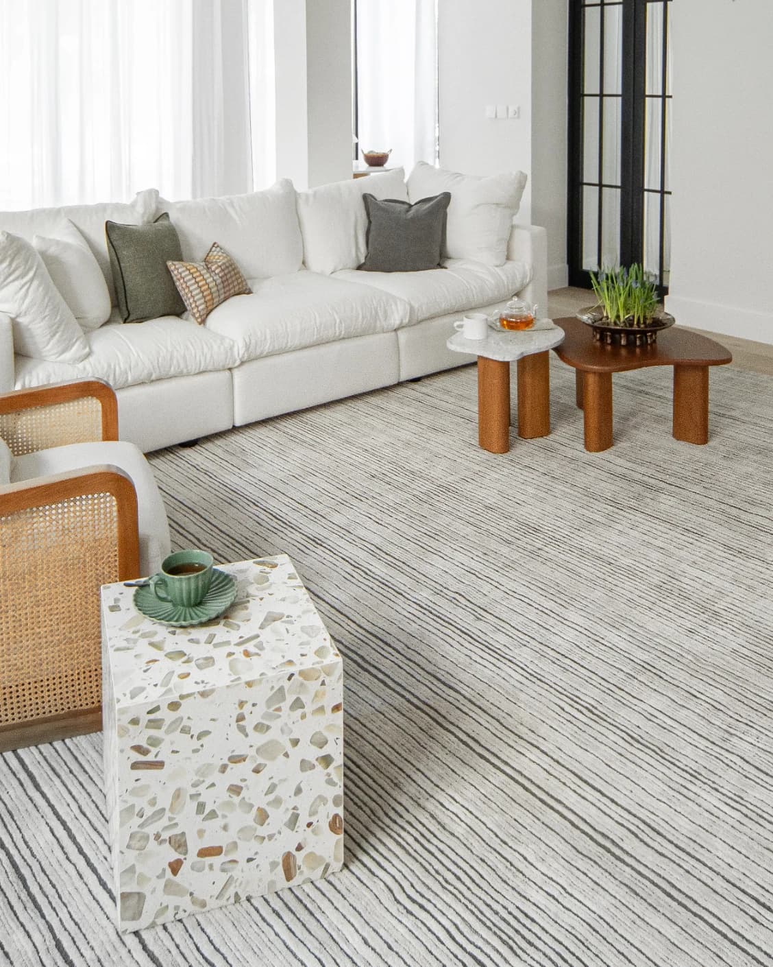 Theodore Ashton carpet in grey and ivory, shown in a lifestyle left view as image 7