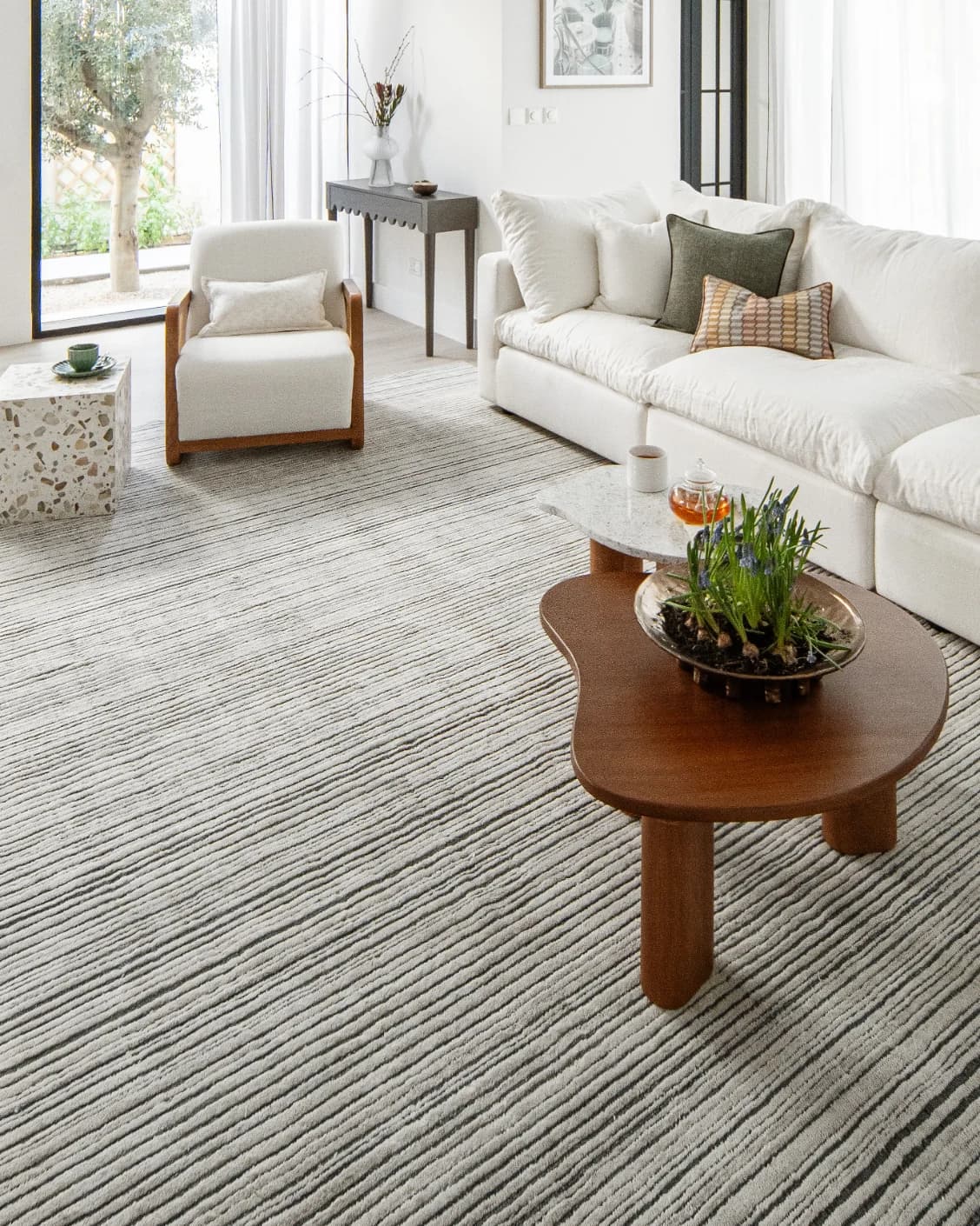 Theodore Ashton carpet in grey and ivory, shown in a lifestyle right view as image 9