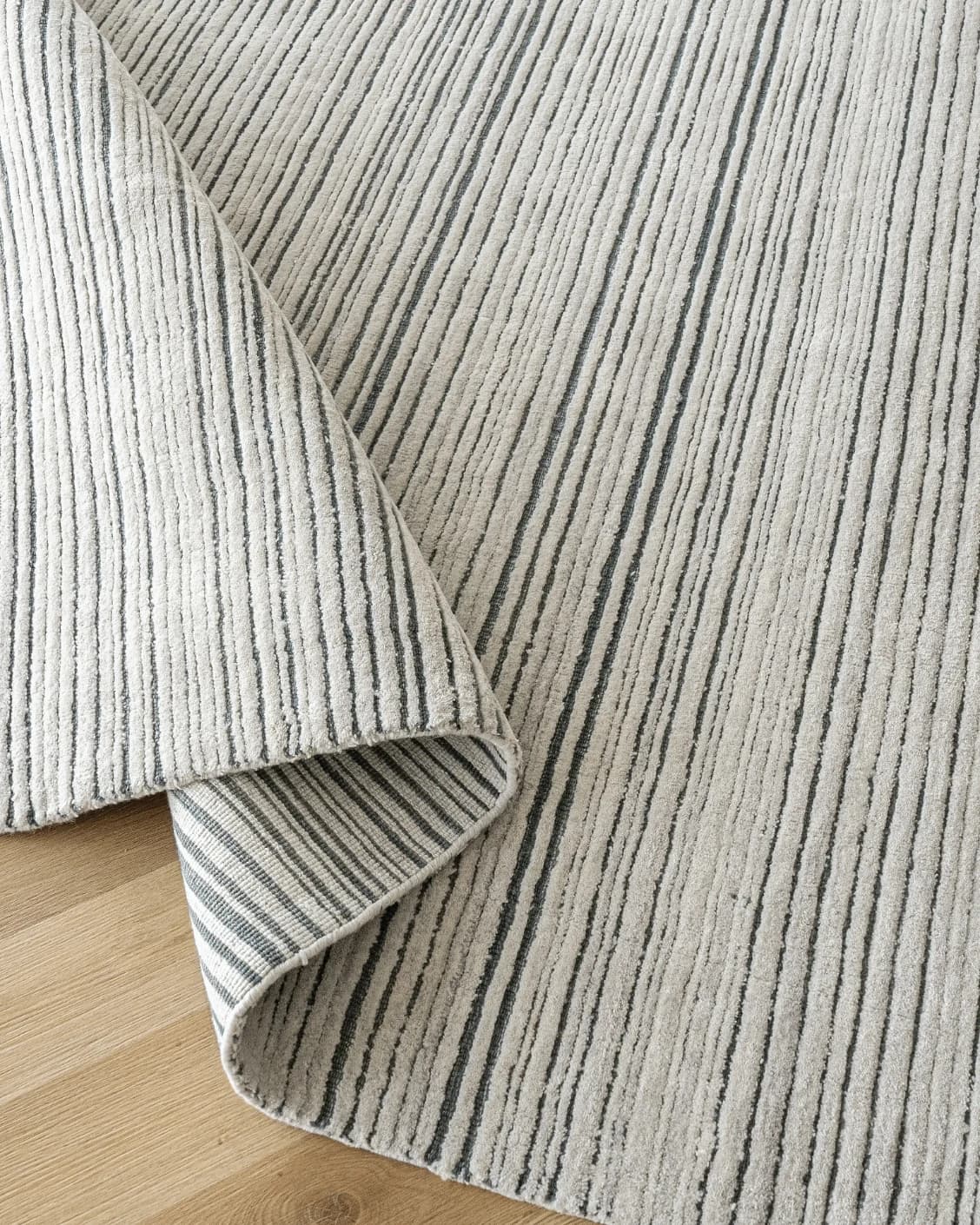 Theodore Ashton carpet in grey and ivory, shown in a product close-up as image 12
