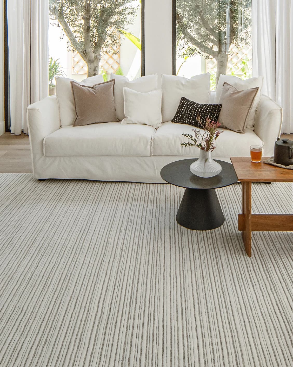Theodore Dune carpet in dune, grey and white, shown in a lifestyle front view as image 7