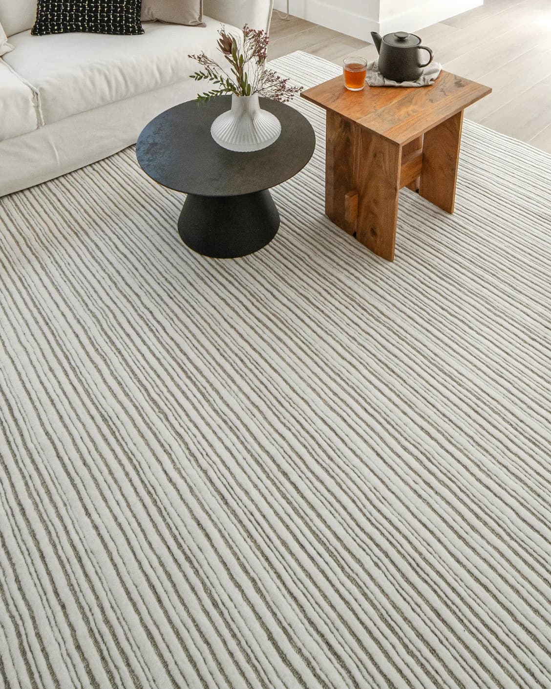 Theodore Dune carpet in dune, grey and white, shown in a lifestyle top view as image 10