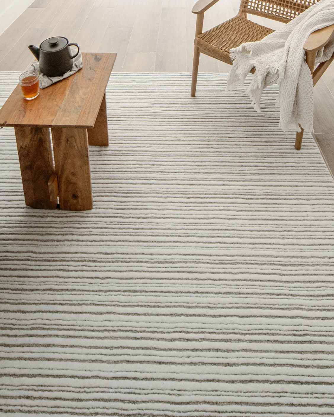 Theodore Dune carpet in dune, grey and white, shown in a lifestyle top view as image 11