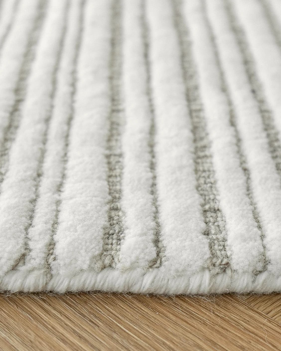 Theodore Dune carpet in dune, grey and white, shown in a product close-up as image 12