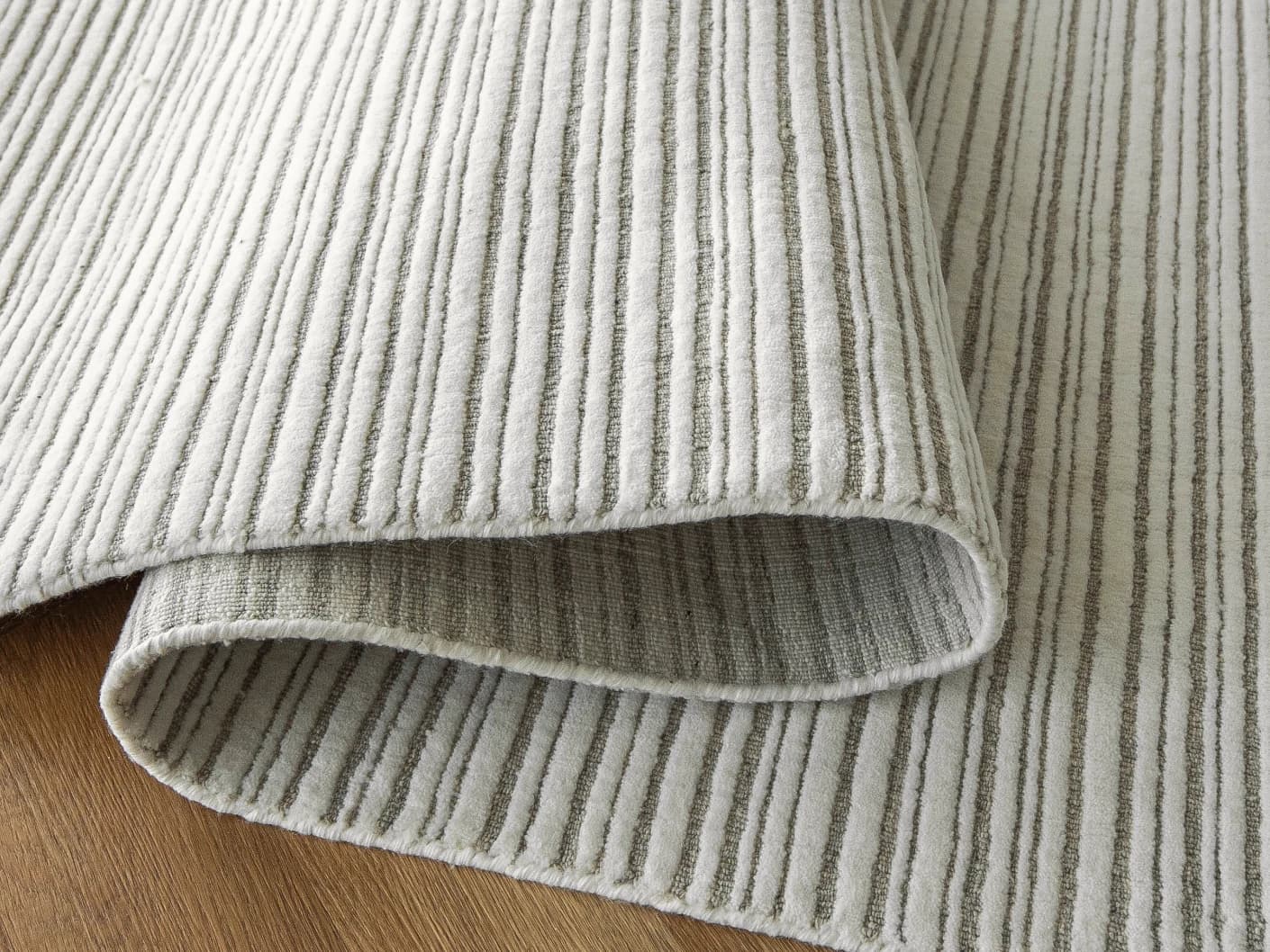Theodore Dune carpets in dune, grey and white, shown in a product close-up view