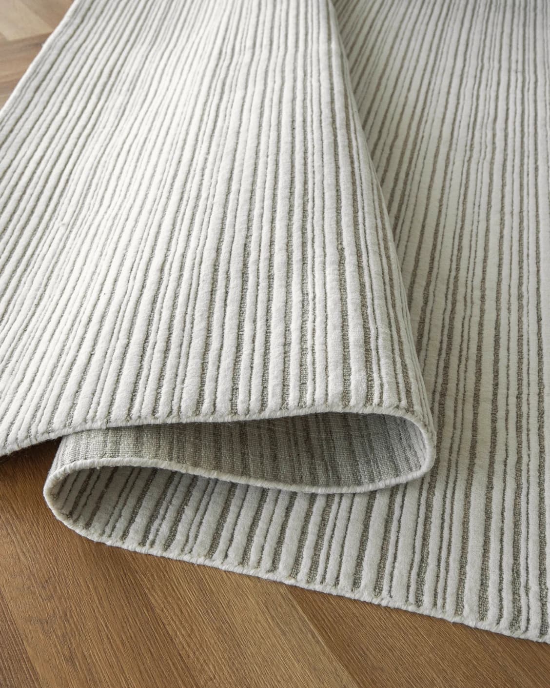 Theodore Dune carpet in dune, grey and white, shown in a product close-up as image 14