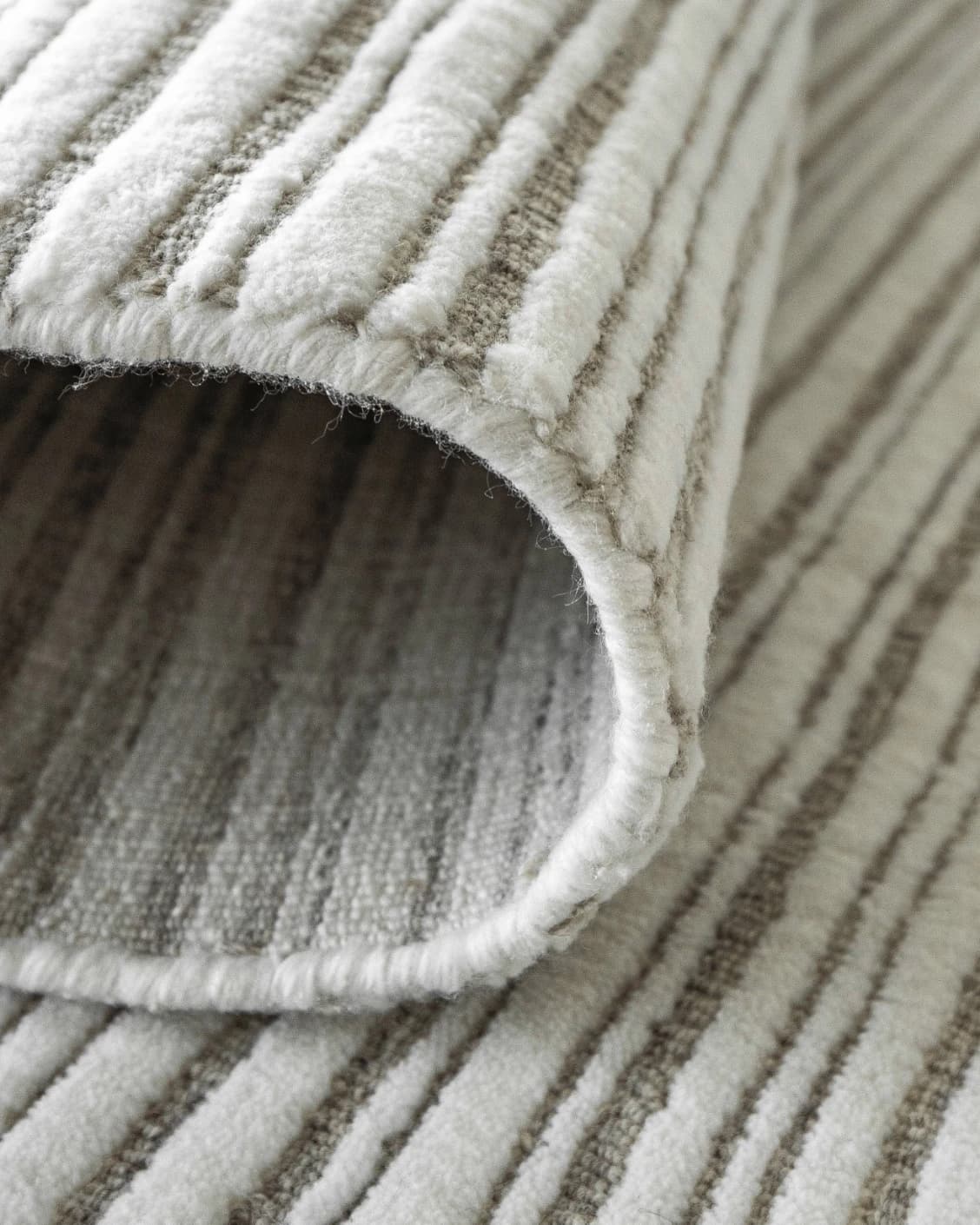 Theodore Dune carpet in dune, grey and white, shown in a product close-up as image 15