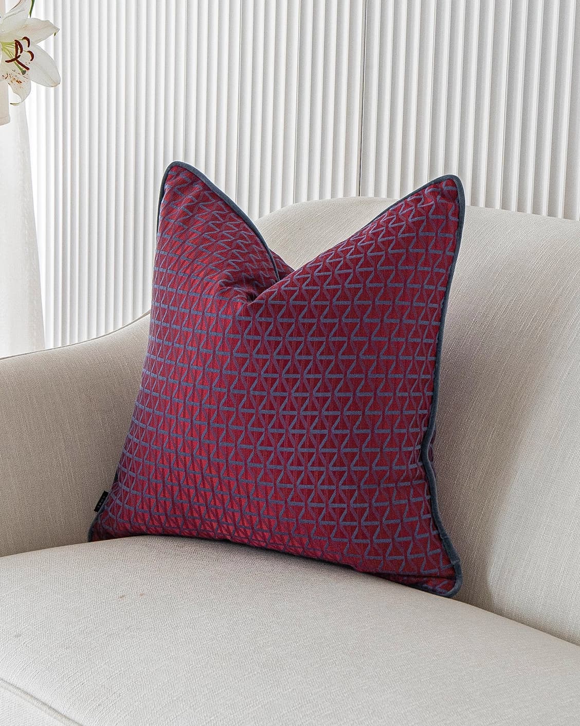 Thylane Canova I cushion in red and purple, shown in a lifestyle front view as image 2