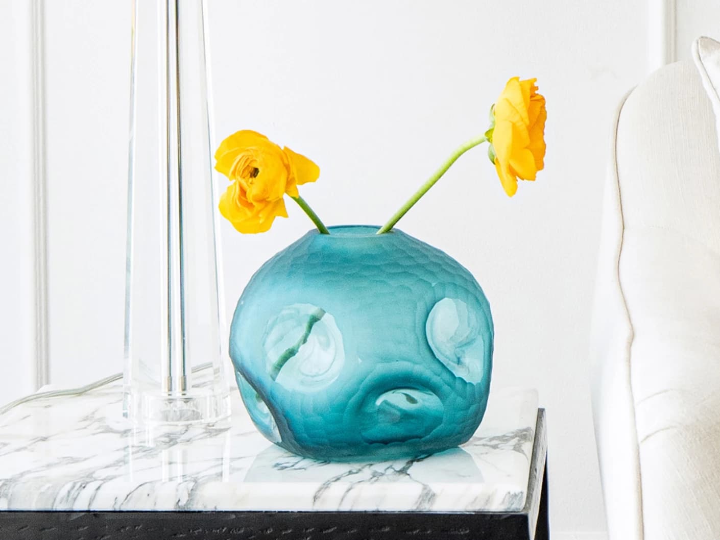 Tiffany Storms II vases in turquoise, shown in a lifestyle front view