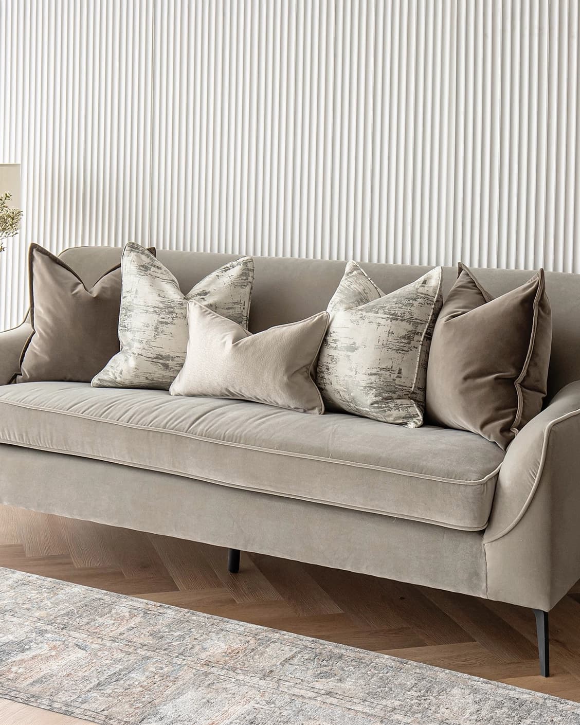Timmy Bundle cushion in gold, brown, beige, grey and white, shown in a lifestyle right view as image 2