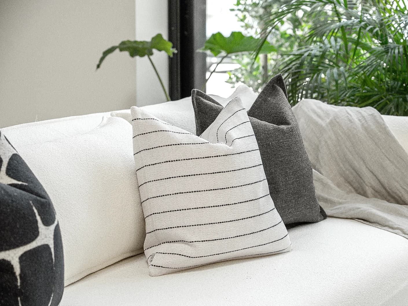 Tova Bundle bundle cushions in black and white, shown in a product front view