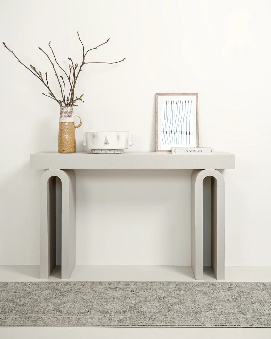 Trento console table in soft ivory and stone, shown in a lifestyle front view as image 2