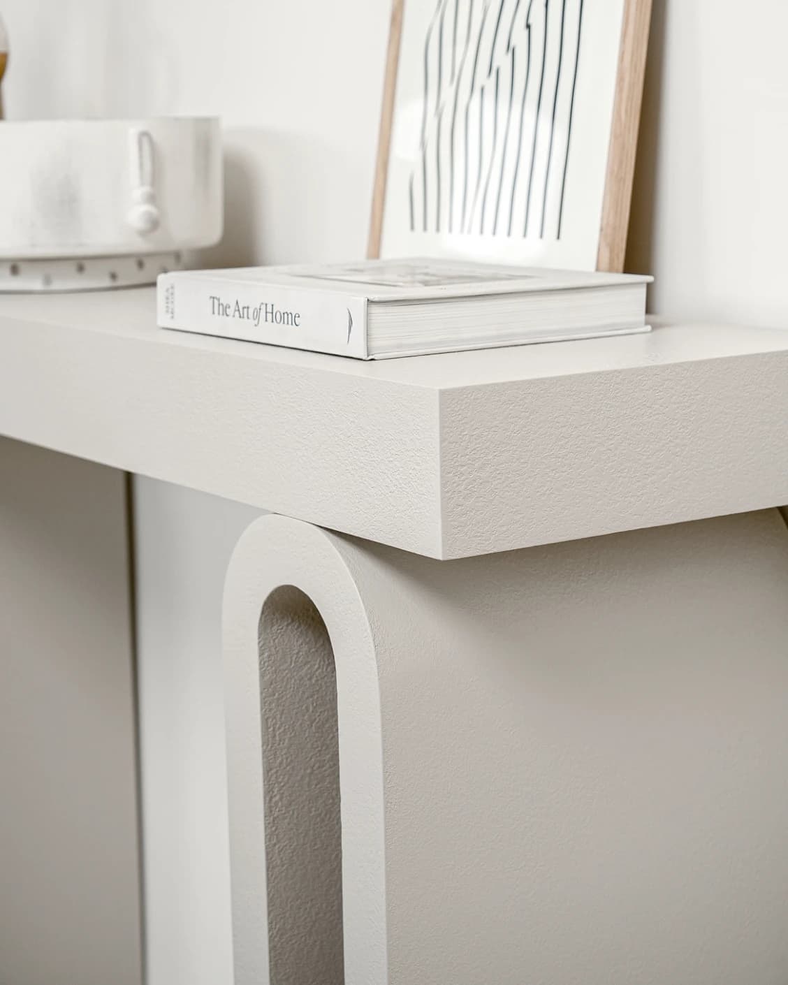 Trento Console Table Soft Ivory Stone console table in soft ivory and stone, shown in a lifestyle right view as image 6