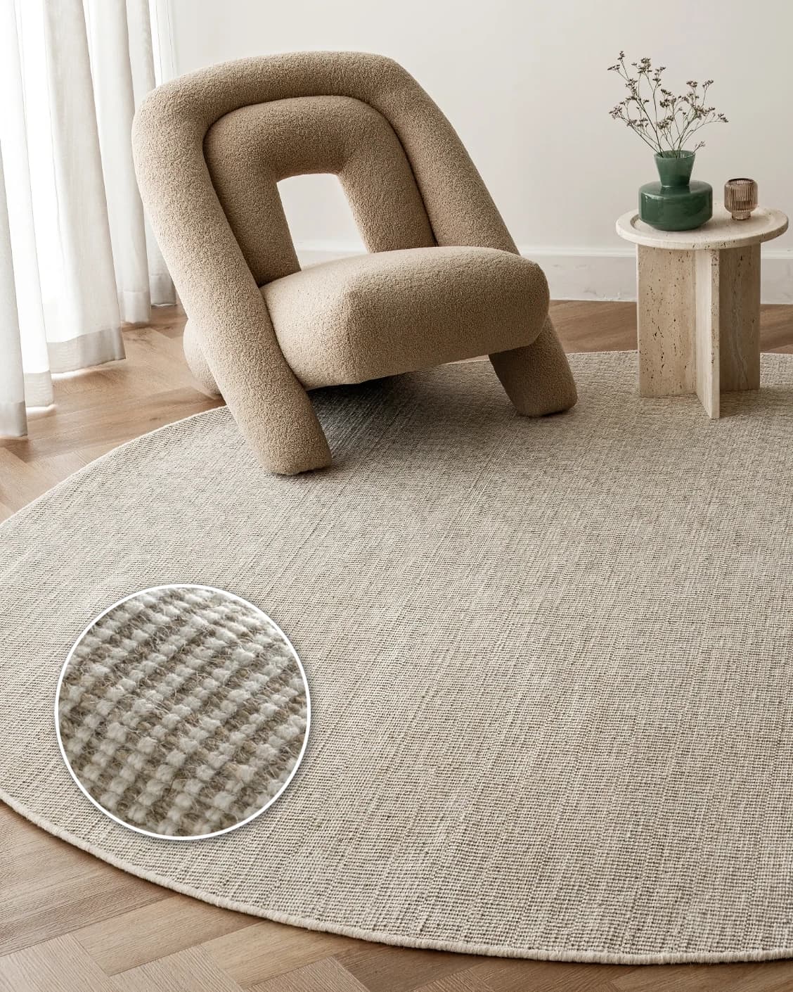 Treva Stone Round carpet in beige and taupe, shown in a lifestyle front view