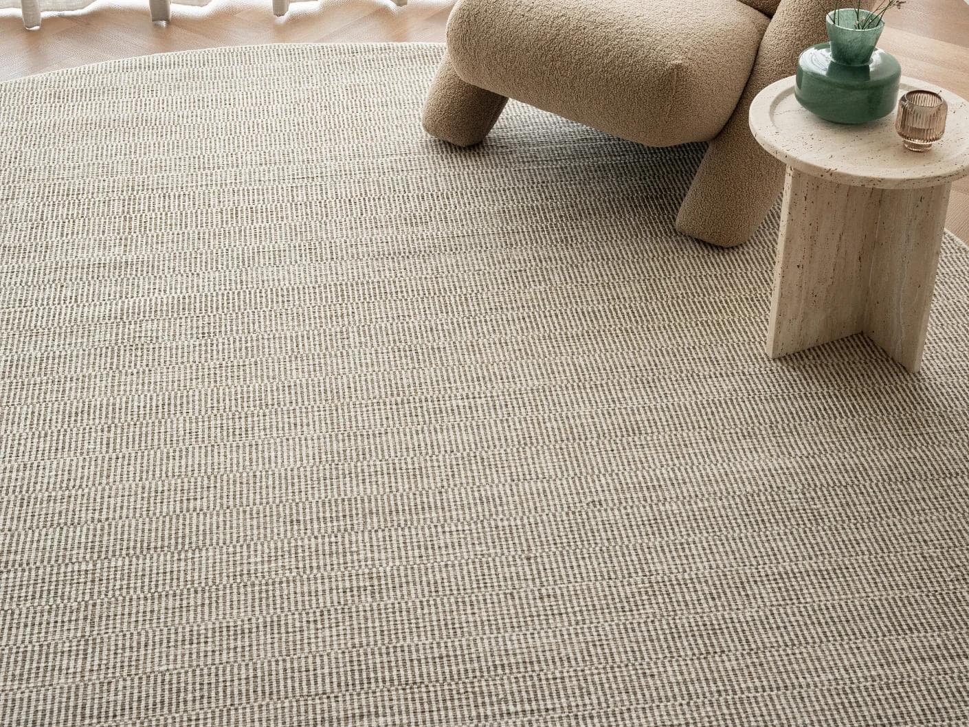 Treva Stone Round carpet in beige and taupe, shown in a lifestyle front view as image 4