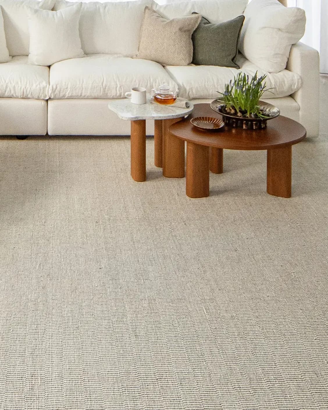 Treva Stone carpet in stone, beige and taupe, shown in a lifestyle front view as image 6