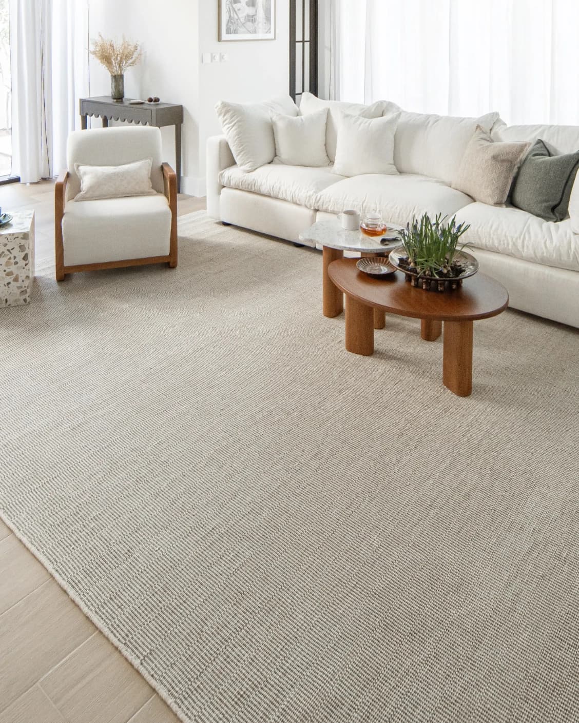 Treva Stone carpet in stone, beige and taupe, shown in a lifestyle right view as image 7