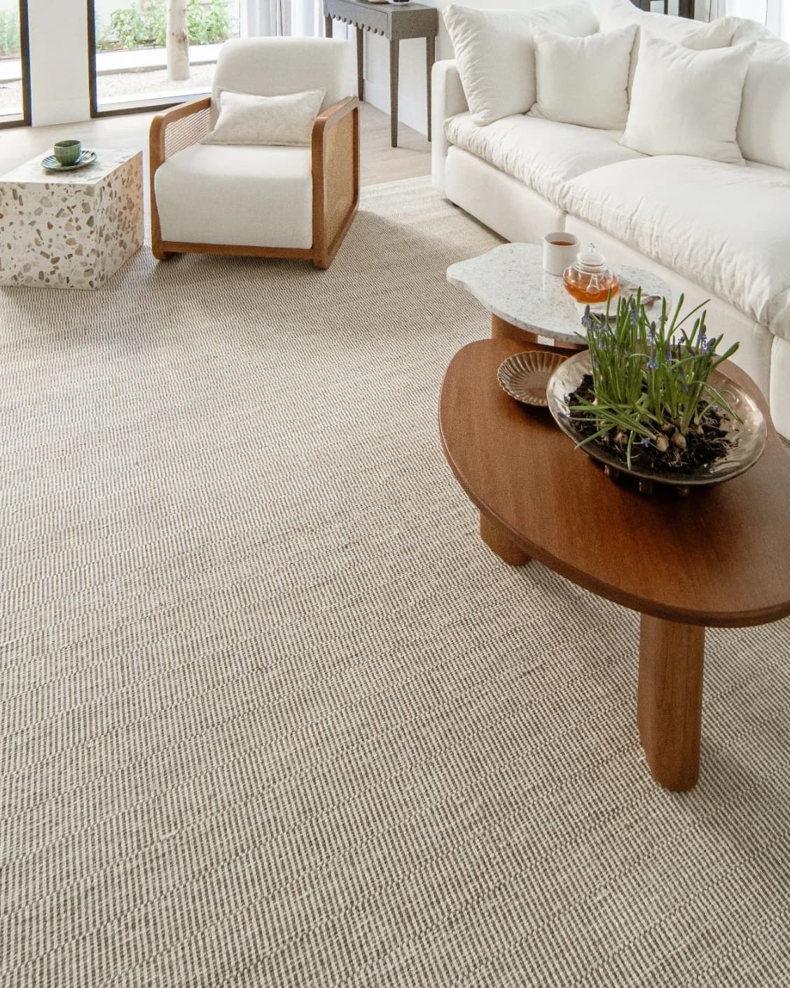 Treva Stone carpet in stone, beige and taupe, shown in a lifestyle right view as image 8