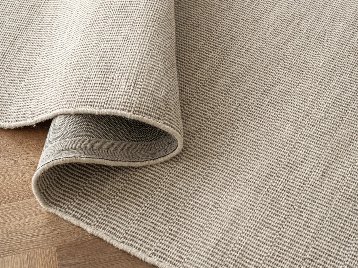 Treva Stone Round carpets in stone, beige and taupe, shown in a product close-up view