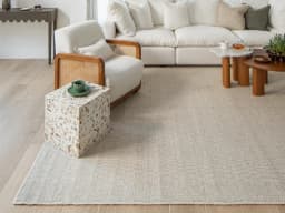 Treva Stone carpet in stone, beige and taupe, shown in a lifestyle front view