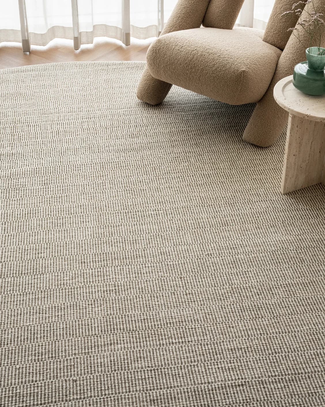 Treva Stone Round carpet in stone, beige and taupe, shown in a lifestyle front view as image 4