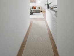 Treva Stone Runners carpet in stone, beige and taupe, shown in a lifestyle front view