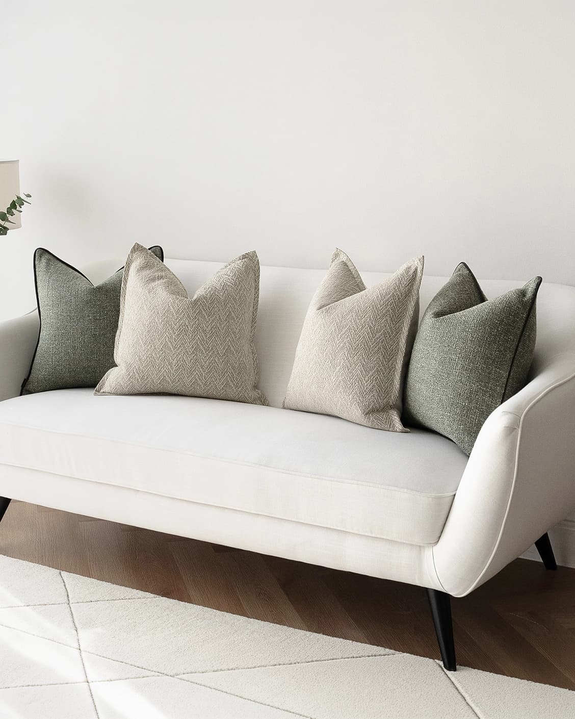 Trish Bundle cushion in beige and green, shown in a lifestyle right view as image 2