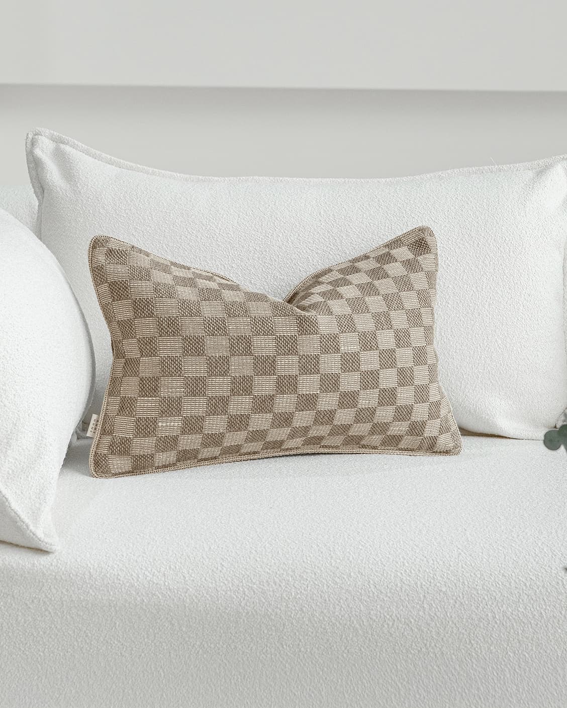 Troi Klimt II cushion in taupe and beige, shown in a lifestyle front view as image 2