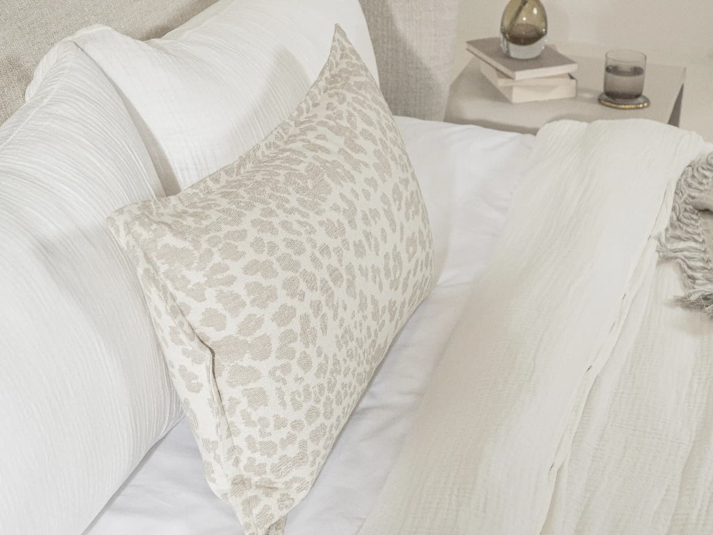 Val Klimt III single cushions in beige, shown in a lifestyle left view