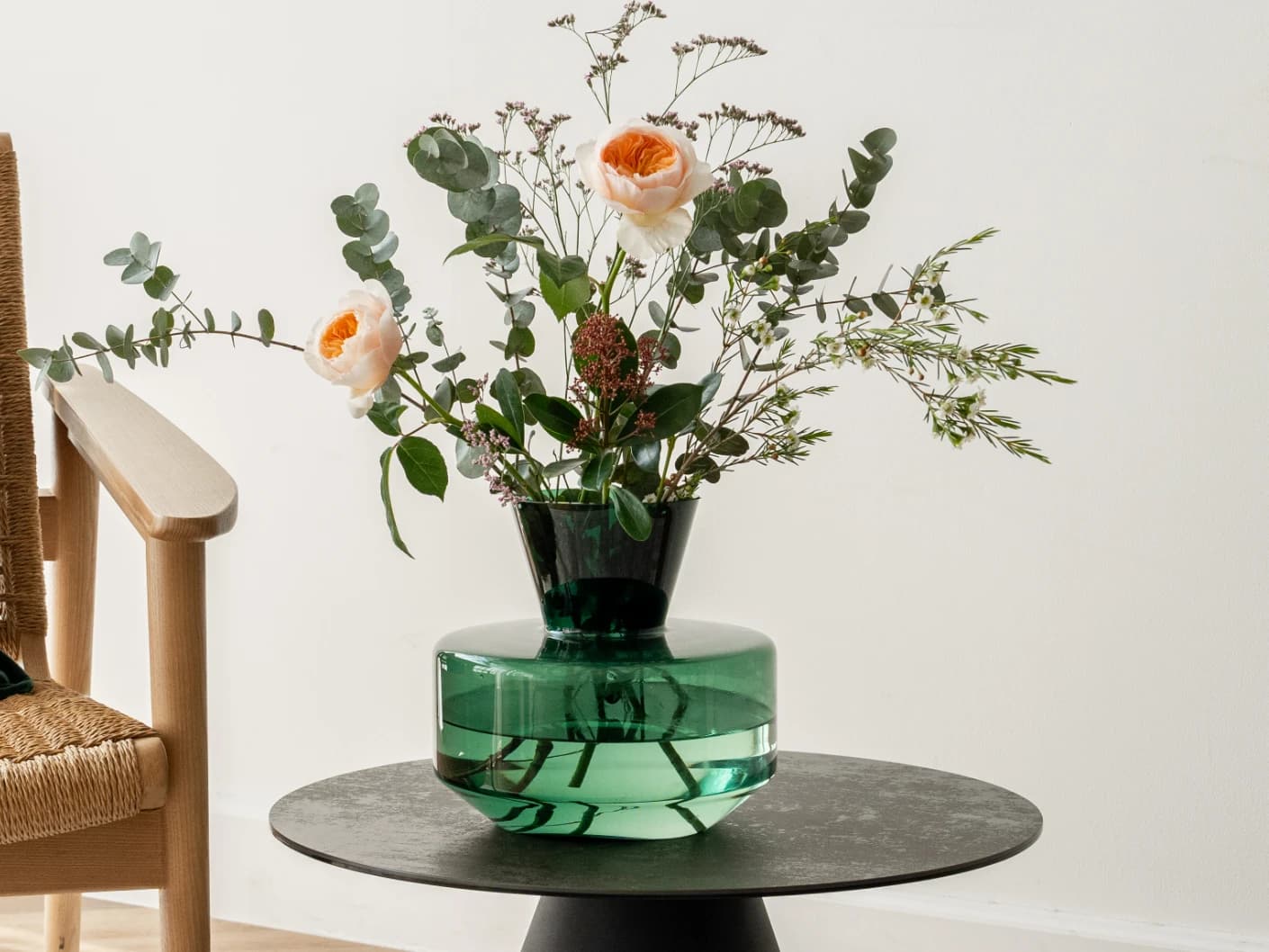 Verdell Storms vases in green, shown in a lifestyle front view