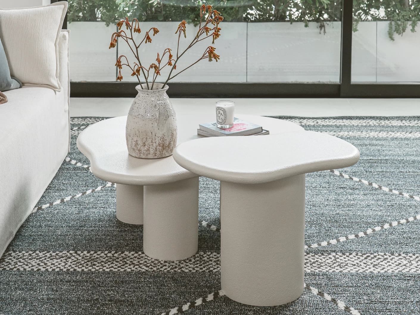 Verona side table in soft ivory and stone, shown in a lifestyle left view as image 3