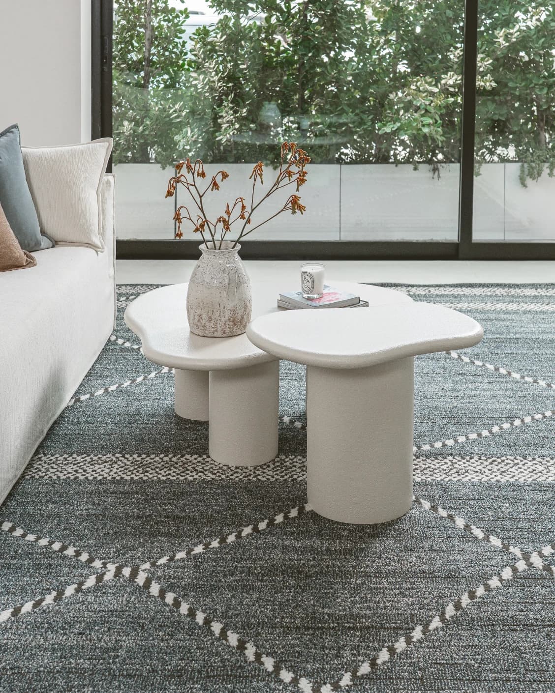 Verona side table in soft ivory and stone, shown in a lifestyle left view as image 3
