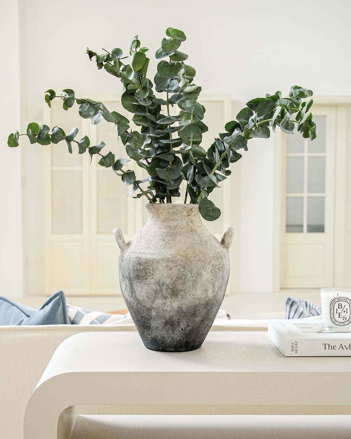Vess Terra vases in stone and grey, shown in a lifestyle front view