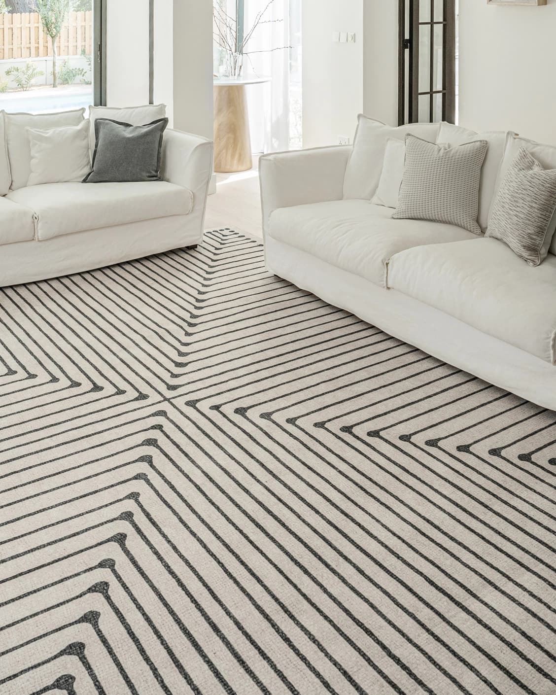 Vince Bianca carpet in black and white, shown in a lifestyle front view as image 4