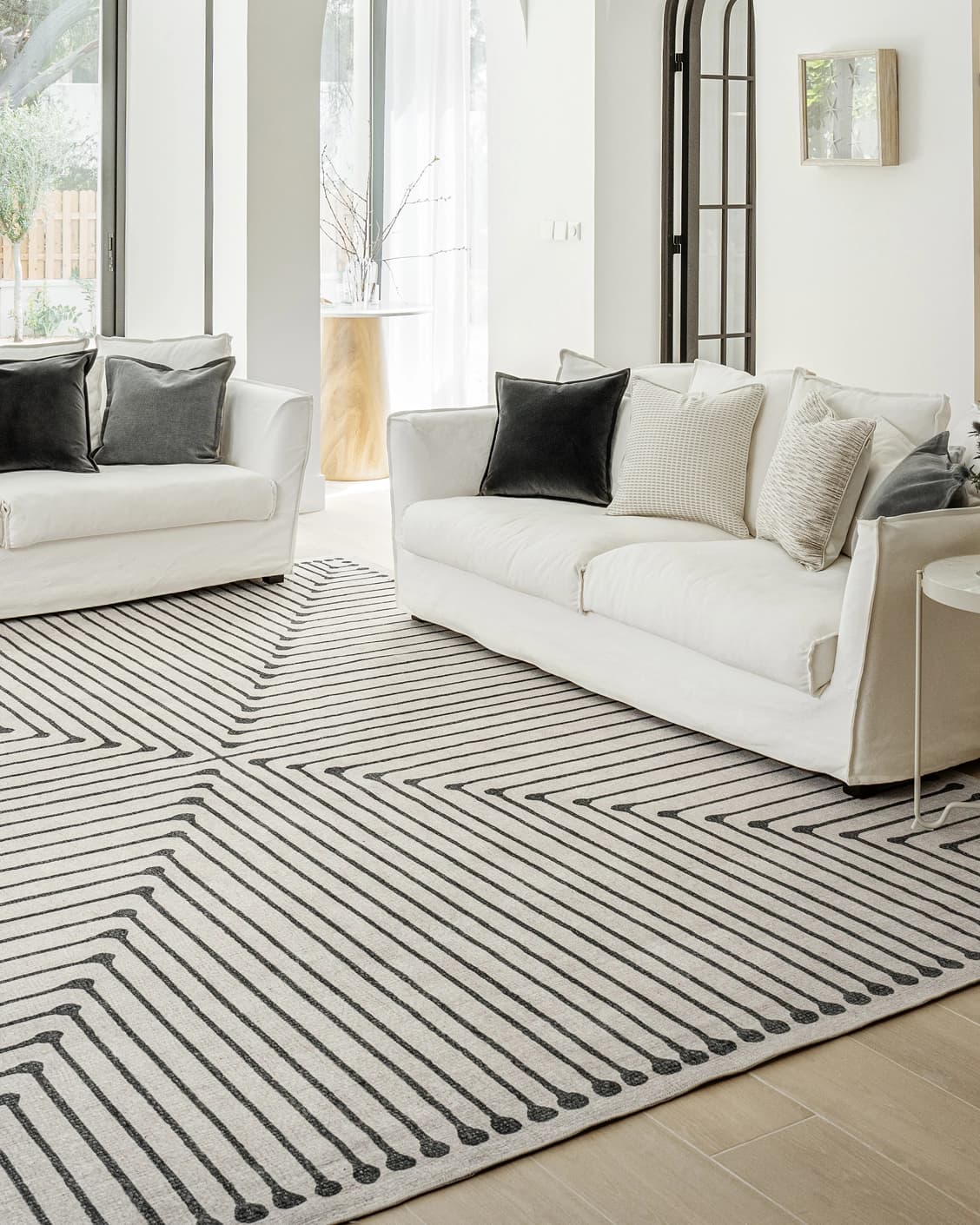 Vince Bianca carpet in black and white, shown in a lifestyle front view as image 5