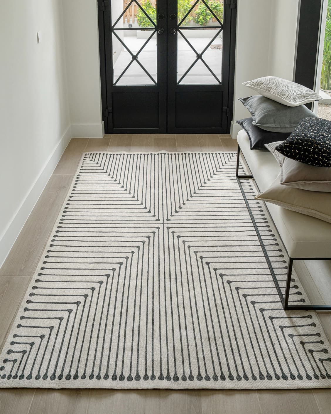 Vince Bianca carpet in black and white, shown in a lifestyle front view as image 6