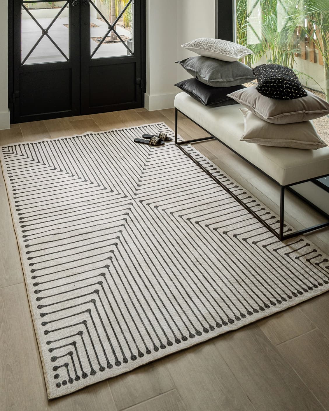 Vince Bianca carpet in black and white, shown in a lifestyle right view as image 7