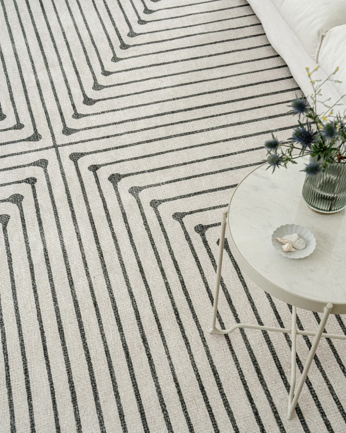 Vince Bianca carpet in black and white, shown in a lifestyle top view as image 9