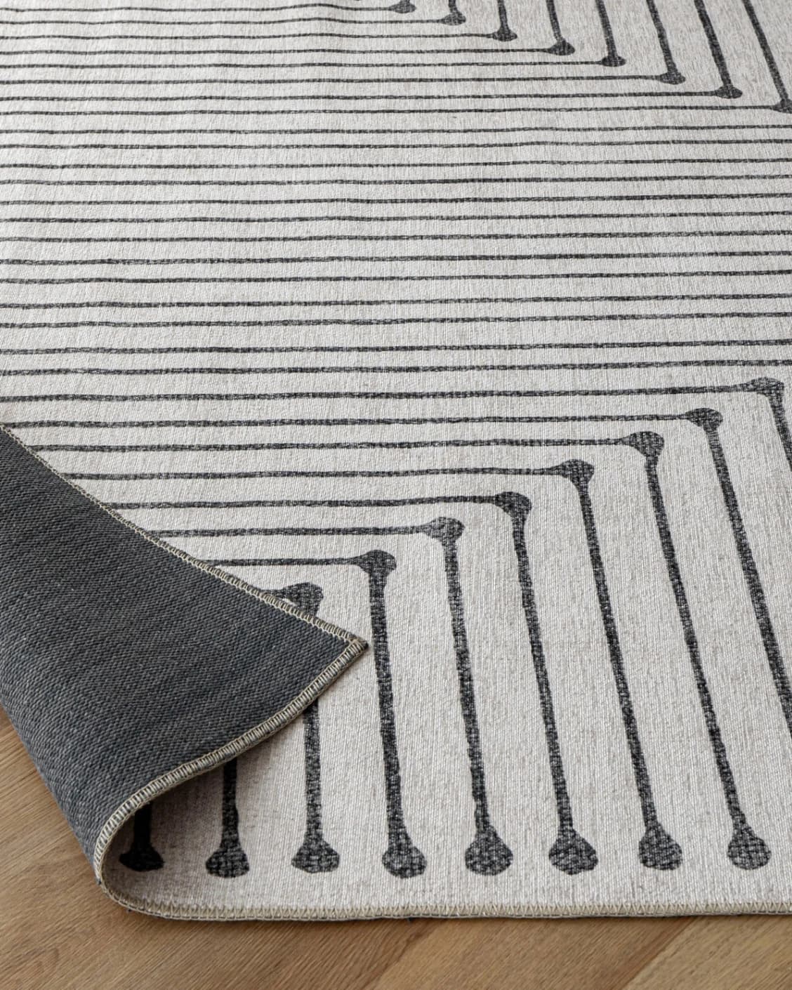 Vince Bianca carpet in black and white, shown in a product close-up as image 10