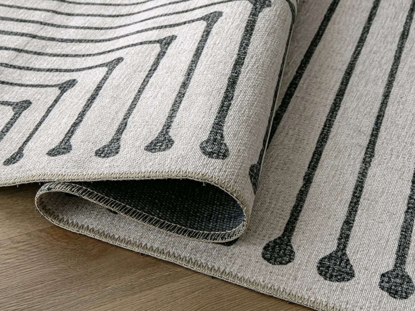 Vince Bianca carpets in black and white, shown in a product close-up view