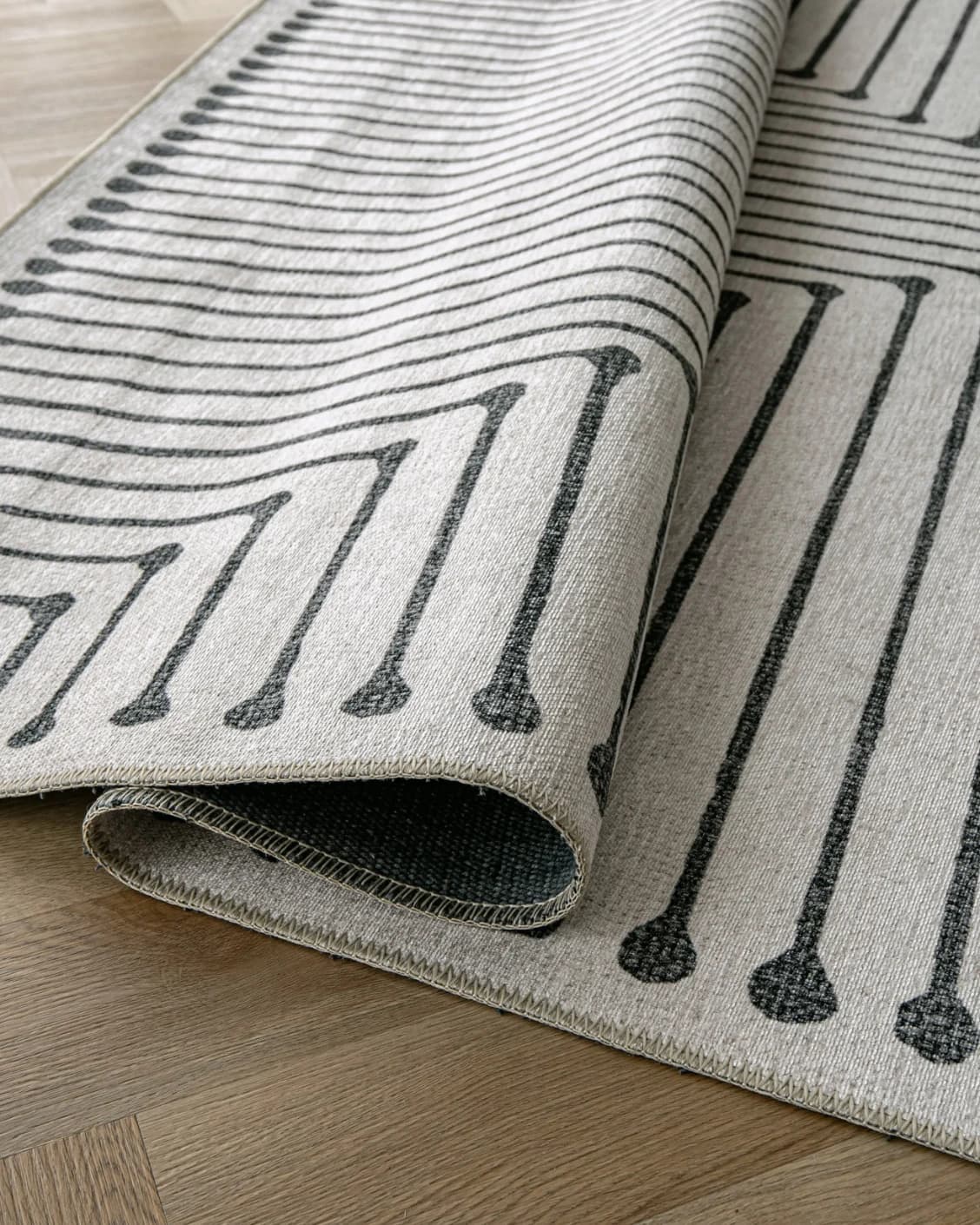 Vince Bianca carpet in black and white, shown in a product close-up as image 11