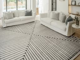 Vince Bianca carpet in black and white, shown in a lifestyle front view