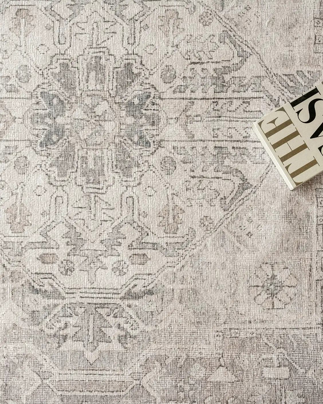 Vince Clay carpet in beige and grey, shown in a lifestyle top view as image 9