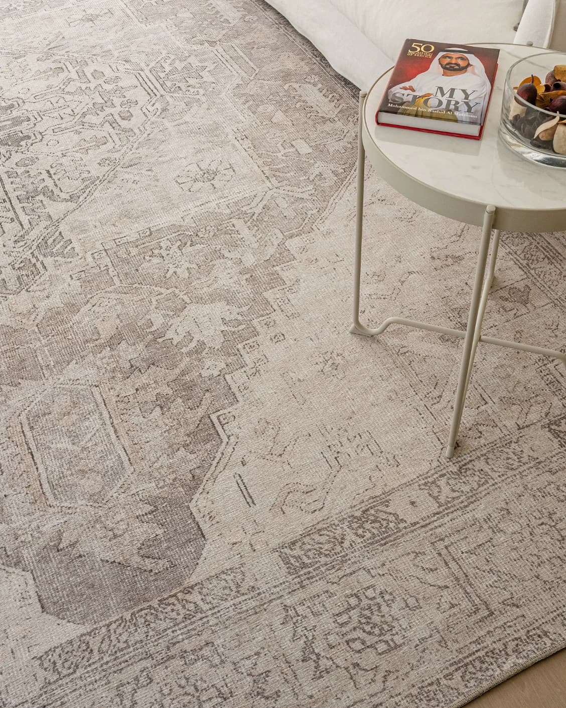 Vince Clay carpet in beige and grey, shown in a lifestyle top view as image 10