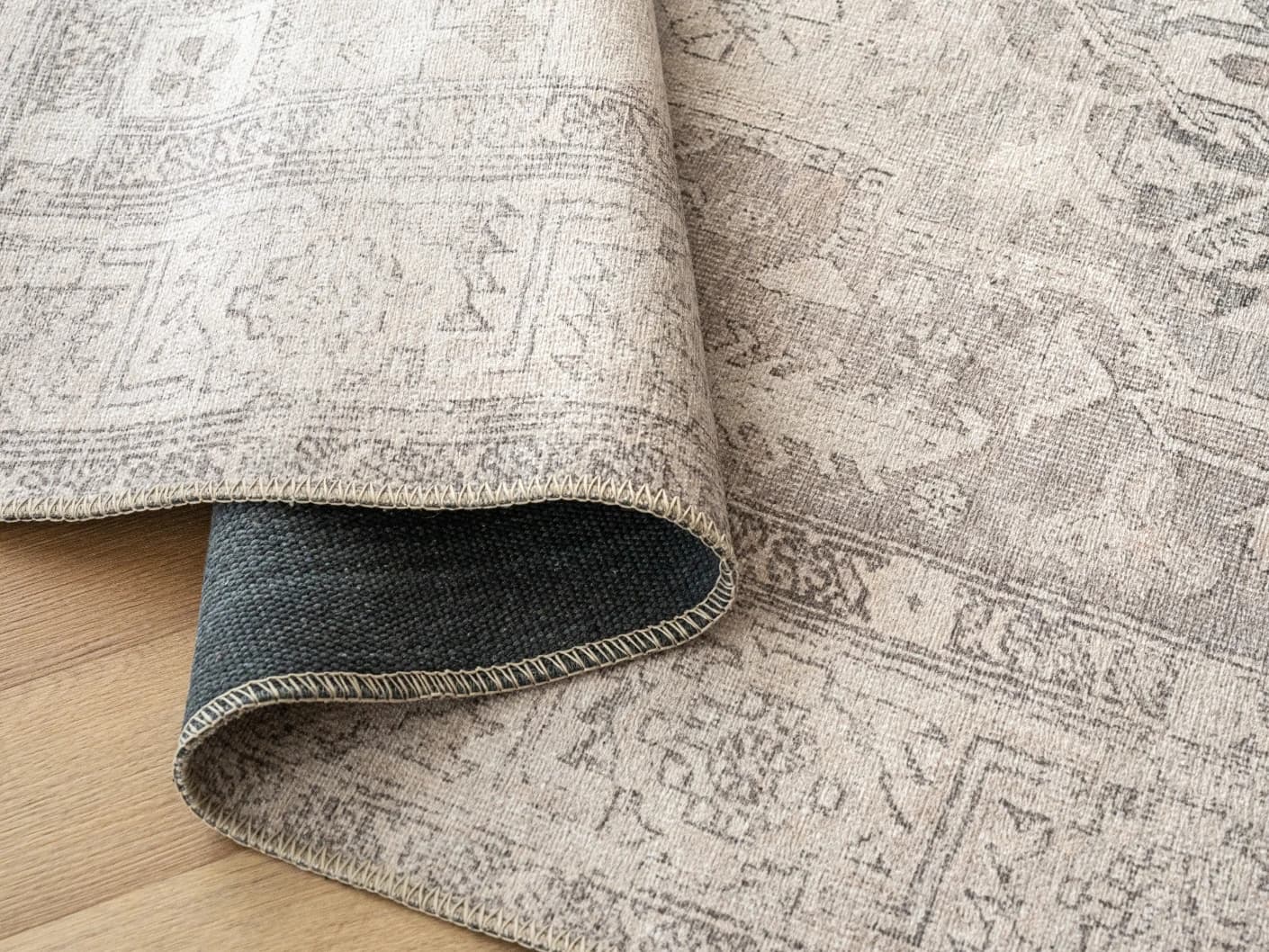 Vince Clay carpets in clay, beige and grey, shown in a product close-up view