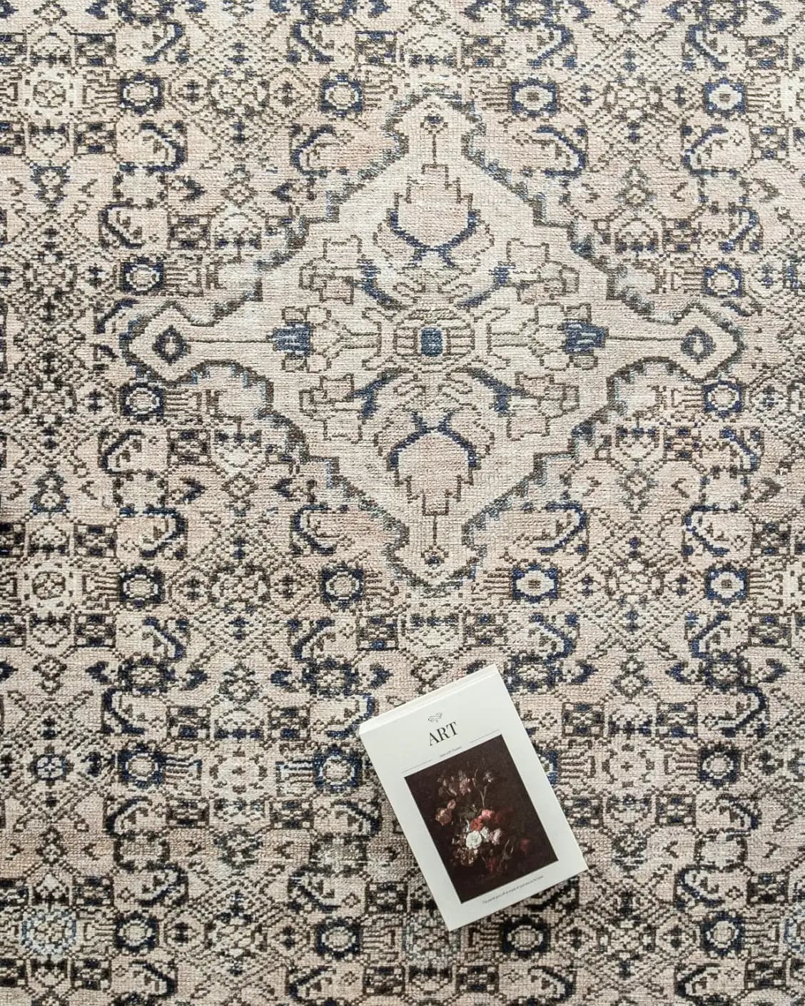 Vince Dune carpet in brown and beige, shown in a lifestyle top view as image 8